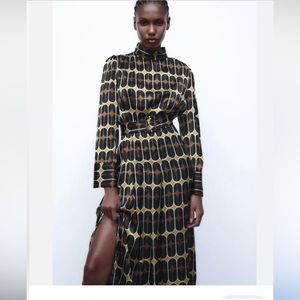 Brand new.  Beautiful Zara dress. With pleated detail and slit